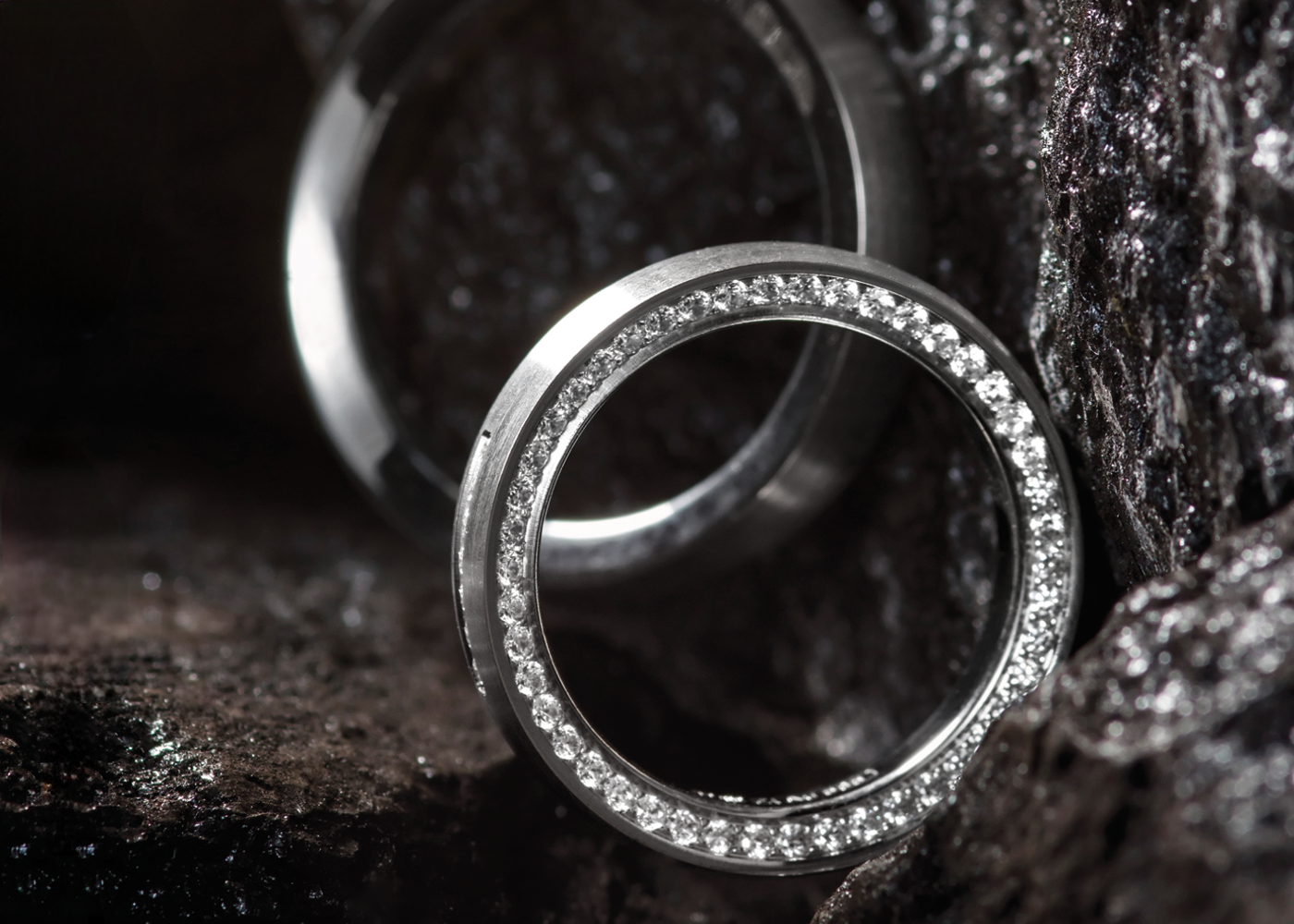 Two rings standing in an rocky environment. 
