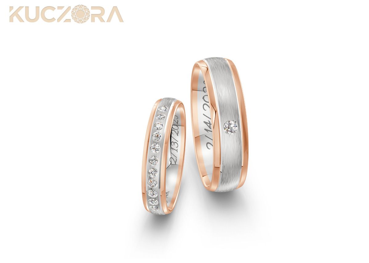 A pair of two tone diamond engagement bands with wedding dates engraved.