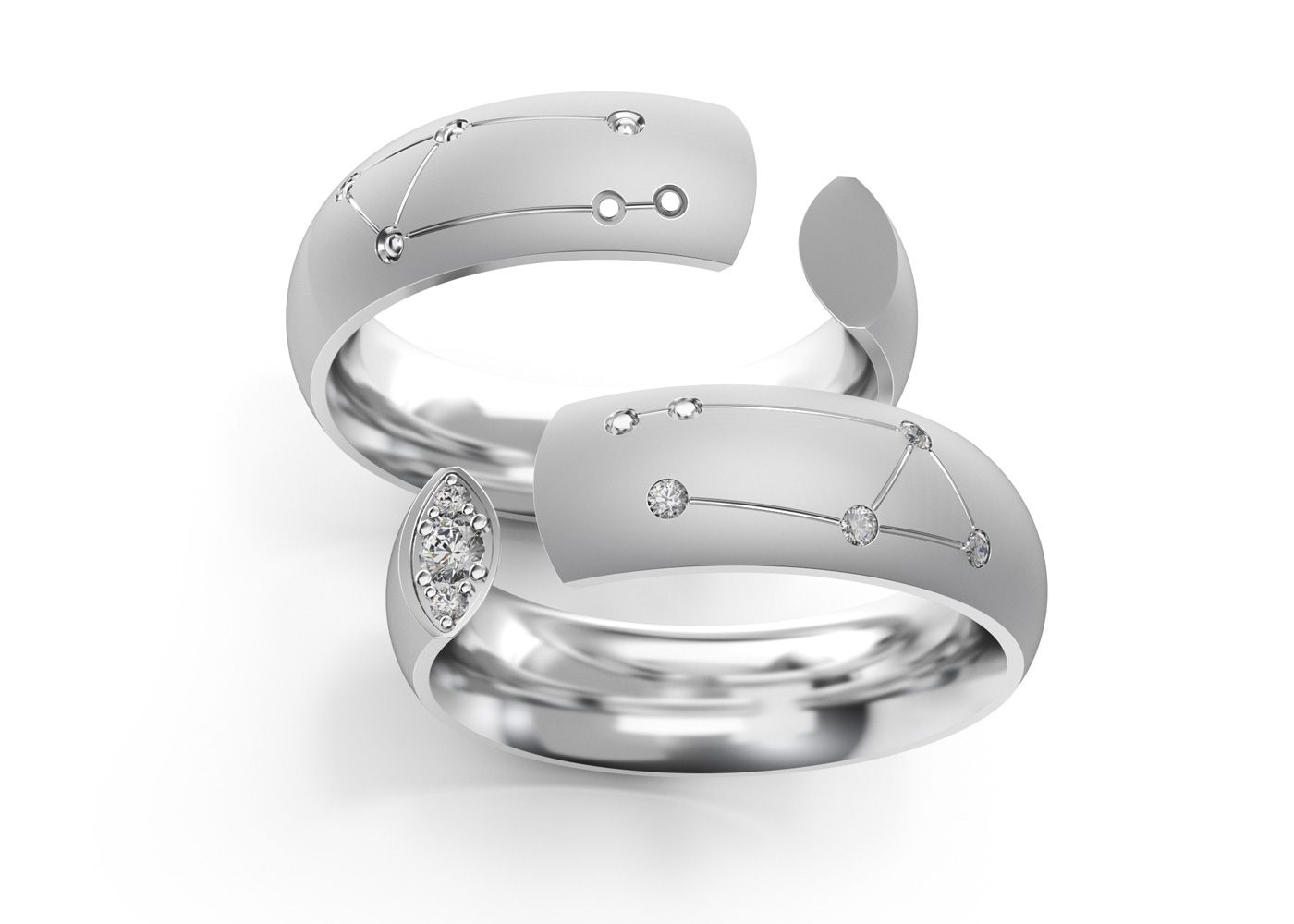 Pair of silver Libra rings from the Zodiac Collection on white background.
