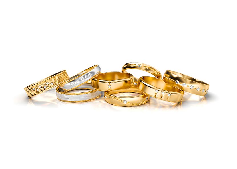 A collection of Kuczora designed rings on white background